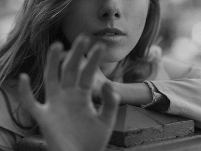 A dynamic shot of a man in the middle of a jump squat.