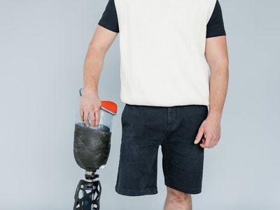 Man holding a difficult balance pose on one leg.